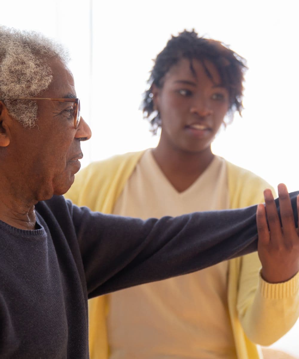 A carer helping a client with everyday tasks at home